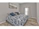 Spacious bedroom with king-size bed and coastal-themed decor at 18322 Garman Ave, Port Charlotte, FL 33948