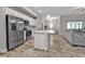 Modern kitchen with stainless steel appliances and an island at 18322 Garman Ave, Port Charlotte, FL 33948