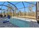 Enclosed pool area with a spacious deck and a surrounding fence at 18322 Garman Ave, Port Charlotte, FL 33948