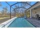 Screened pool with patio and seating area at 18322 Garman Ave, Port Charlotte, FL 33948