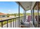 Screened balcony with seating and partial view of the area at 1839 Settlers Dr # B-6, Nokomis, FL 34275