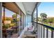 Screened balcony with seating and a view of neighboring units at 1839 Settlers Dr # B-6, Nokomis, FL 34275