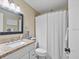 Clean bathroom with granite countertops and shower/tub combo at 1839 Settlers Dr # B-6, Nokomis, FL 34275