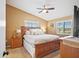 Main bedroom with wooden bed frame and nightstands at 1839 Settlers Dr # B-6, Nokomis, FL 34275