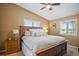 Spacious main bedroom with a king-size bed and wood furniture at 1839 Settlers Dr # B-6, Nokomis, FL 34275