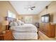 Spacious main bedroom with large dresser and TV at 1839 Settlers Dr # B-6, Nokomis, FL 34275