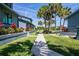 Pathway meanders through a tropical garden setting at 1839 Settlers Dr # B-6, Nokomis, FL 34275