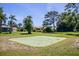 Private putting green surrounded by lush landscaping at 1839 Settlers Dr # B-6, Nokomis, FL 34275