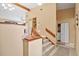 Clean and bright stairwell with a laundry closet at 1839 Settlers Dr # B-6, Nokomis, FL 34275