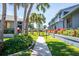 Landscaped walkway with lush tropical foliage at 1839 Settlers Dr # B-6, Nokomis, FL 34275