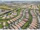 Wide aerial view of a large residential community with a lake at 19119 Mangieri St, Venice, FL 34293