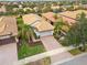 Aerial view of single-Gathering home with tile roof, driveway, and landscaping at 19119 Mangieri St, Venice, FL 34293