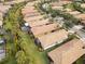 Aerial view of houses, showcasing a community with a long lawn at 19119 Mangieri St, Venice, FL 34293