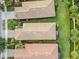 Aerial view of houses, highlighting the uniformity of rooftops at 19119 Mangieri St, Venice, FL 34293