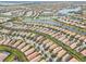 Aerial perspective of a large community near a lake at 19119 Mangieri St, Venice, FL 34293