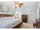 Spacious bedroom with ceiling fan, large windows and dresser at 19119 Mangieri St, Venice, FL 34293