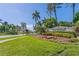 Islandwalk community entrance with lush landscaping and palm trees at 19119 Mangieri St, Venice, FL 34293