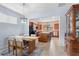 Dining area with a wooden table and chairs, open to the living room at 19119 Mangieri St, Venice, FL 34293