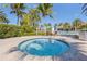 Relaxing spa tub surrounded by lush landscaping at 19119 Mangieri St, Venice, FL 34293