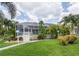 Screened pool and patio area with lush landscaping at 195 Bayshore Ct, Punta Gorda, FL 33950