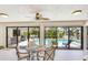 Breakfast nook with glass table and view of the pool at 195 Bayshore Ct, Punta Gorda, FL 33950