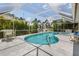 Relaxing kidney-shaped pool with screened enclosure at 195 Bayshore Ct, Punta Gorda, FL 33950