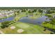 Aerial view of community with lake and golf course at 2100 Kings Hwy # 100, Port Charlotte, FL 33980