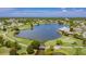 Expansive aerial view of the golf course and lake at 2100 Kings Hwy # 100, Port Charlotte, FL 33980