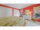 Main bedroom with a red wall and white dresser at 2100 Kings Hwy # 100, Port Charlotte, FL 33980