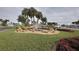 Community entrance with landscaped fountain at 2100 Kings Hwy # 100, Port Charlotte, FL 33980