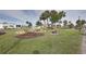 Landscaped area with fountain and benches at 2100 Kings Hwy # 100, Port Charlotte, FL 33980