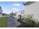 Rear view of home showing a spacious yard and landscaping at 2100 Kings Hwy # 100, Port Charlotte, FL 33980