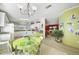 Kitchen with a green island and adjoining dining area at 2100 Kings Hwy # 100, Port Charlotte, FL 33980