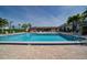 Refreshing community pool with surrounding lounge chairs at 2100 Kings Hwy # 100, Port Charlotte, FL 33980