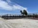 Newly resurfaced tennis courts with chain link fence at 2100 Kings Hwy # 100, Port Charlotte, FL 33980