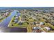 Aerial view of a waterfront community with many houses at 2210 Bengal Ct, Punta Gorda, FL 33983