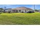 Large backyard with screened enclosure and spacious lawn at 2210 Bengal Ct, Punta Gorda, FL 33983