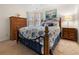 Guest bedroom with a wooden bed frame and seashell bedding at 2210 Bengal Ct, Punta Gorda, FL 33983