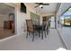 Covered patio with table and chairs, offering access to the interior at 2210 Bengal Ct, Punta Gorda, FL 33983