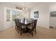 Dining room with six chairs and large window at 2210 Bengal Ct, Punta Gorda, FL 33983