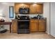 View of kitchen with wood cabinets and stainless steel range at 2210 Bengal Ct, Punta Gorda, FL 33983