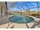 Relaxing kidney-shaped pool with screened enclosure at 2210 Bengal Ct, Punta Gorda, FL 33983