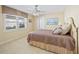 Comfortable bedroom with carpeted floor and large window at 2427 St Davids Island Ct, Punta Gorda, FL 33950