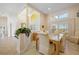 Bright dining room features wood table and chairs, with access to the kitchen at 2427 St Davids Island Ct, Punta Gorda, FL 33950