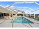 Inviting pool area with covered patio and seating at 2427 St Davids Island Ct, Punta Gorda, FL 33950