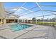 Relaxing pool area with a screened enclosure and water view at 2427 St Davids Island Ct, Punta Gorda, FL 33950