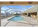 Inviting swimming pool with covered patio and water views at 2427 St Davids Island Ct, Punta Gorda, FL 33950