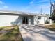 Back exterior view showing sliding glass doors and AC unit at 2529 Flagami Ln, North Port, FL 34286