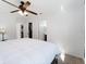 Spacious bedroom with a king-size bed and access to a bathroom at 2529 Flagami Ln, North Port, FL 34286