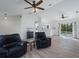 Open concept living room with hardwood floors, a fish tank and access to backyard at 2529 Flagami Ln, North Port, FL 34286